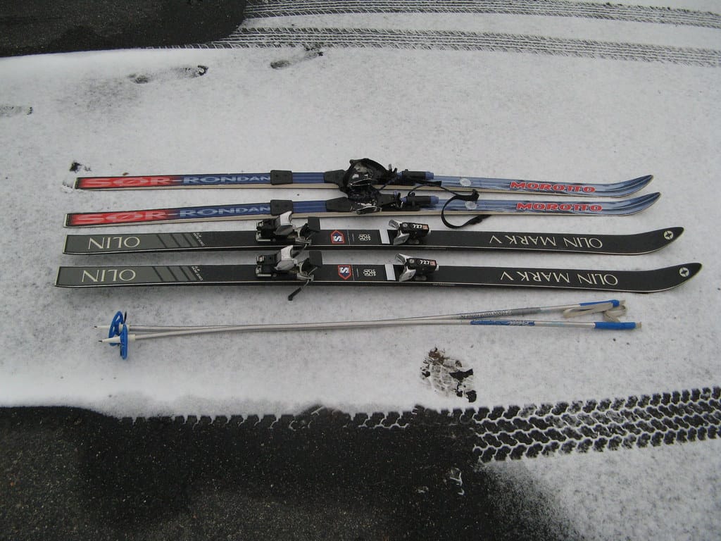 skis and ski bindings on the road
