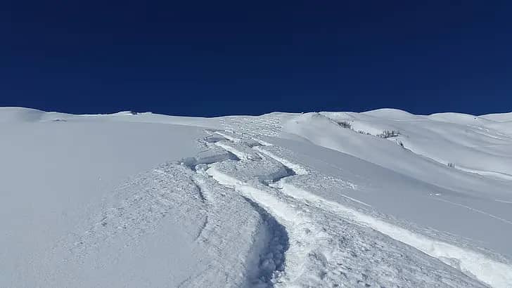 what is off piste skiing - tracks in snow